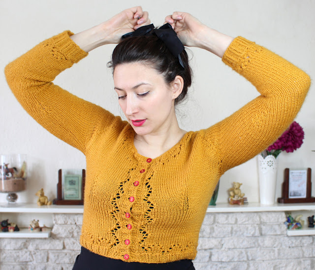 The Butterfly Balcony - Mustard Miette Cardigan Wendy with raised arms, no seams!