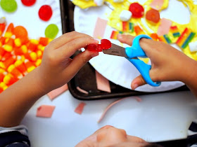 cutting candy with scissors to create candy kids art