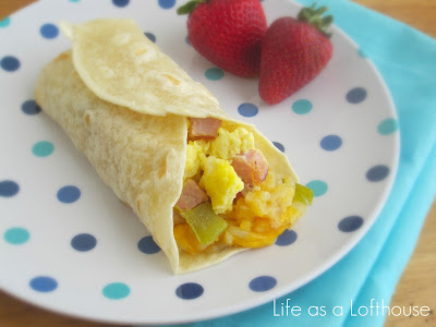 These Breakfast Burritos are stuffed with crispy, cheesy, hash browns, scrambled eggs and diced ham. Life-in-the-Lofthouse.com