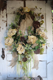 grapevine wreath with cream peonies and assorted foliage and burlap ribbon rustic elegant wreath