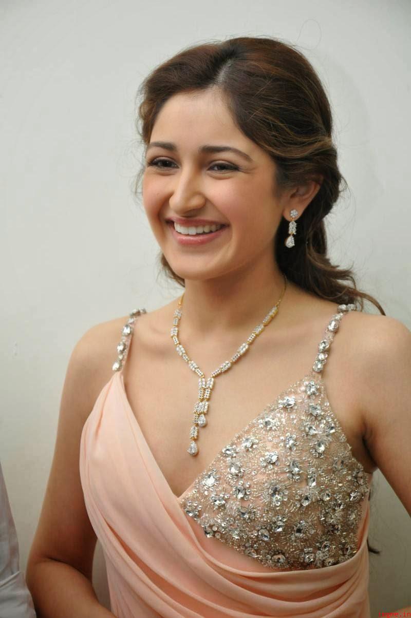 Smiling Look of Sayyeshaa Saigal - Posing in Hot Curves Smiling Look of Sayyeshaa Saigal - Posing in Hot Curves