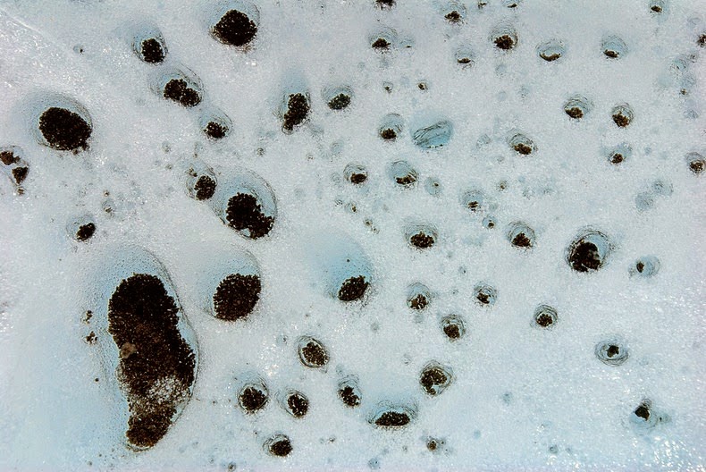 Cryoconite Holes on Glaciers Cryoconite Holes on Glaciers