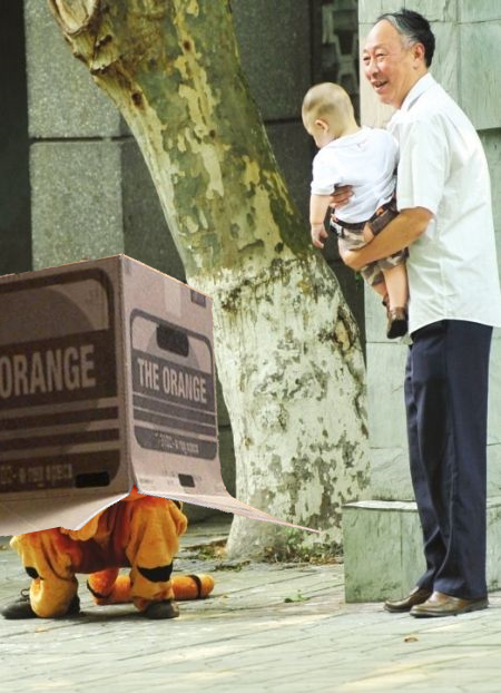Animal escape drill in China's Chengdu Zoo 2011. A zoo employee dressed in a plush tiger costume hides under a large cardboard box. A zoo patron, holding his grandson, points out where the pretend tiger is hiding. The Zoo Houdinis and other stories. marchmatron.com Animal escape drill in China's Chengdu Zoo 2011. A zoo employee dressed in a plush tiger costume hides under a large cardboard box. A zoo patron, holding his grandson, points out where the pretend tiger is hiding. The Zoo Houdinis and other stories. marchmatron.com