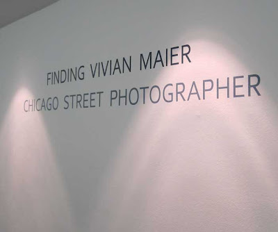 White wall with gray words Finding Vivian Maier: Chicago Street Photographer