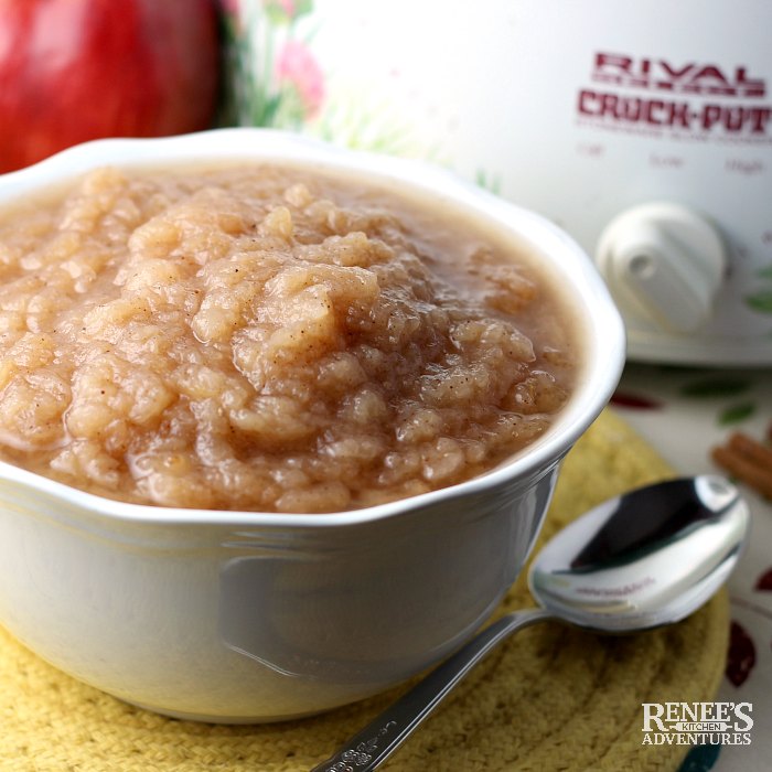 Slow Cooker Applesauce in bowl with apples and crockpot