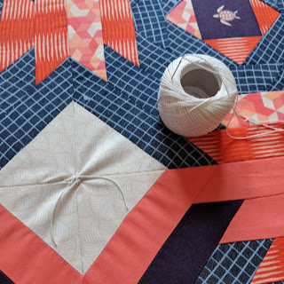 tying a quilt with perle thread