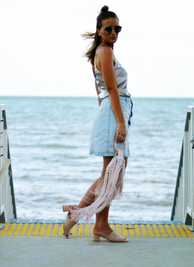 style a silk cami with a denim skirt and statement fringe bag style a silk cami with a denim skirt and statement fringe bag