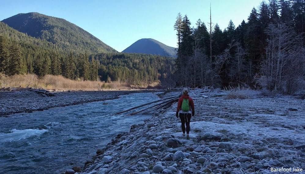 Hiker in winter Elwha Valley, Olympic National Park Elwha River