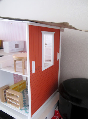 Outside view of  ahlaf-built Lundby dolls' house, showing french doors to where a balcony should be.