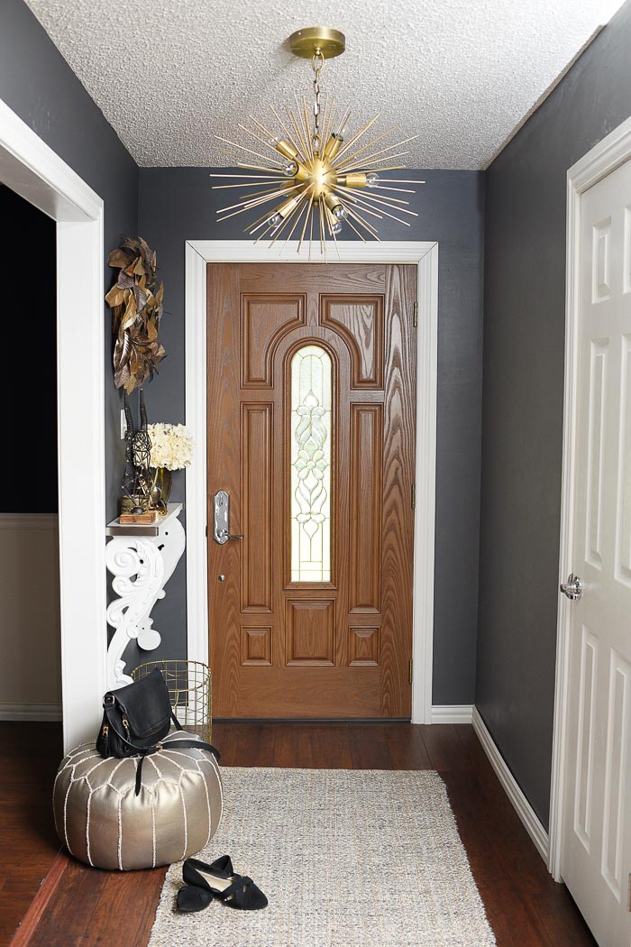 How to decorate a small foyer space. Love her use of gold, metallic neutrals and helpful DIY home decor tips.