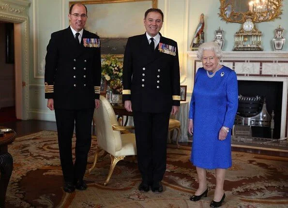 Queen Elizabeth II received the outgoing and incoming Commanding Officers of HMS Queen Elizabeth