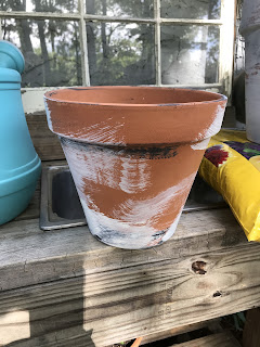 Instructions to age new clay pots with added white paint for a farmhouse old vintage terra cotta pot look.