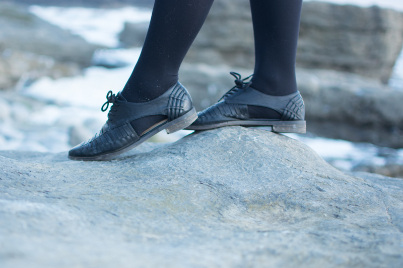 portrait of a girl on the beach long sleeve crop top black milk ancient maps bodycon dress big hipster glasses crystal necklace