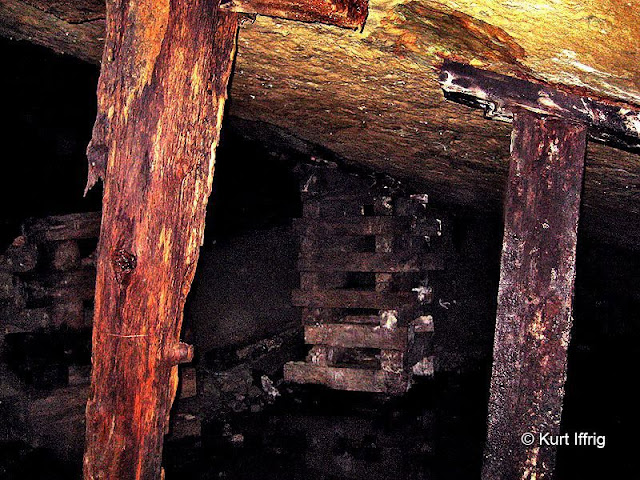 This area has been nicknamed the Lincoln Log Room. The stacked beams are called cribbing. Further back in the mine there are huge rooms supported by these wooden beams.