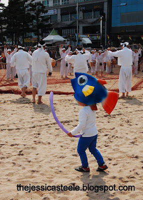 Korean boy wearing fish hat. Gwangan Eobang Festival. Busan, South Korea.