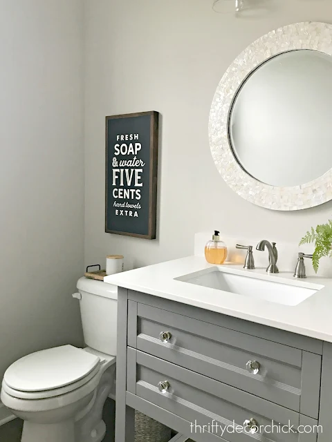 gray vanity round mirror bathroom