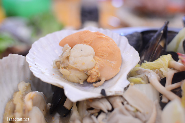 A close up of some of the yums in the seafood pot