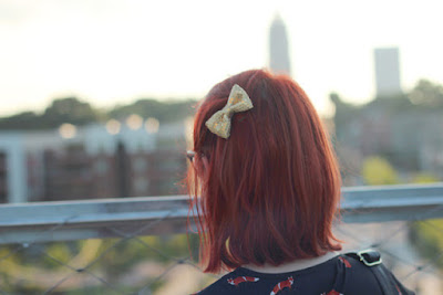 girl wearing a bow in her hair