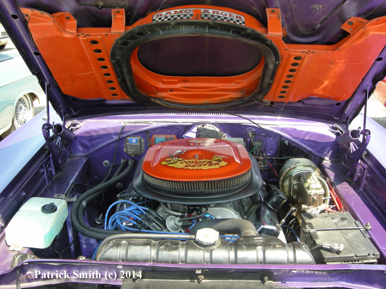 Clean engine bay hides a 440 cid surprise. Day Two look continues with braided hose, blue wires and black valve covers.