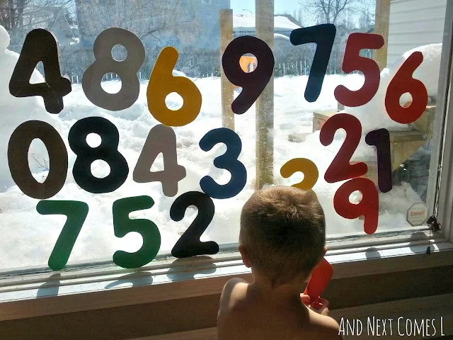 Large DIY craft foam numbers stick to windows when wet