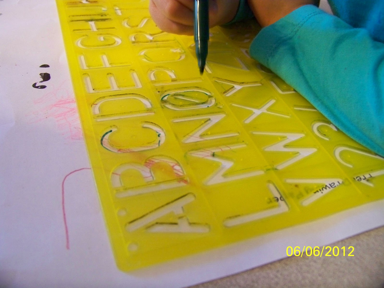 LemonTree Family Child Care Writing Skills Using Stencils to write