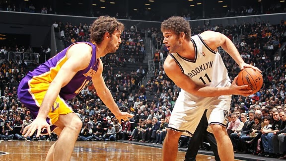 Pau Gasol defends Brook Lopez in a game last year