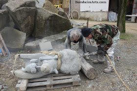 Drilling holes in sculpture base for secure installation Cava Nardini Vellano Tuscany Italy