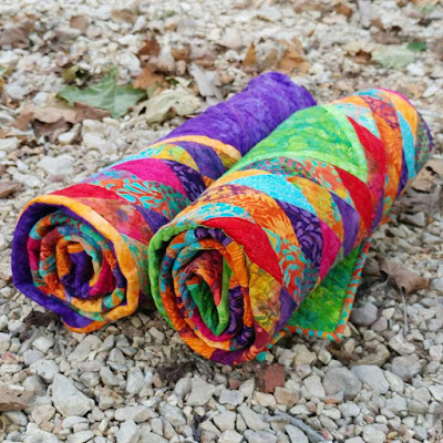 Scrappy Lonestar quilt using Empress Garden fabrics by Island Batik