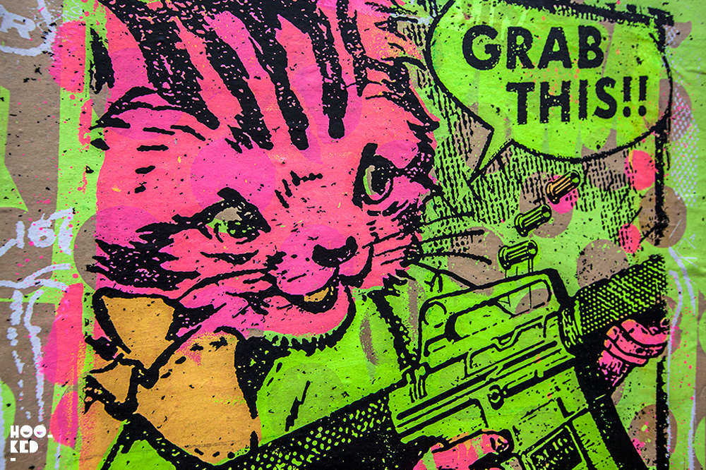 Cat with gun, Brick Lane Street Art Paste-ups in London by artist Zombiesqueegee Cat with gun, Brick Lane Street Art Paste-ups in London by artist Zombiesqueegee