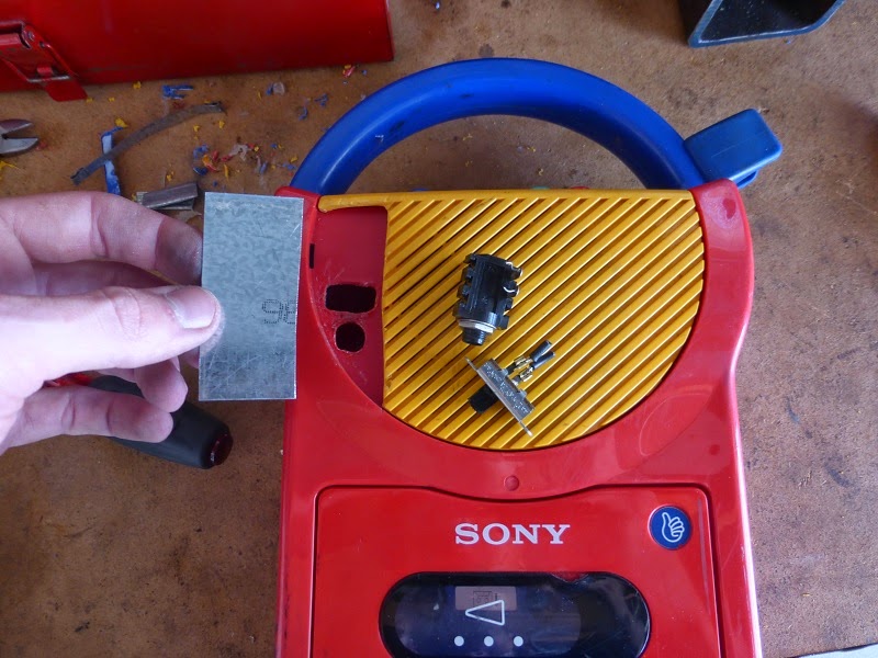 My first Sony after cutting away yellow plastic and piece of galvanized steel.