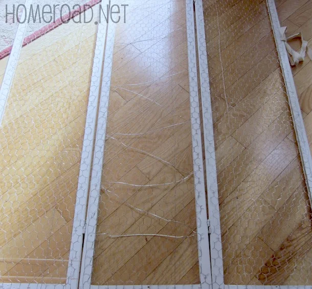 Room divider laying on floor with chicken wire.