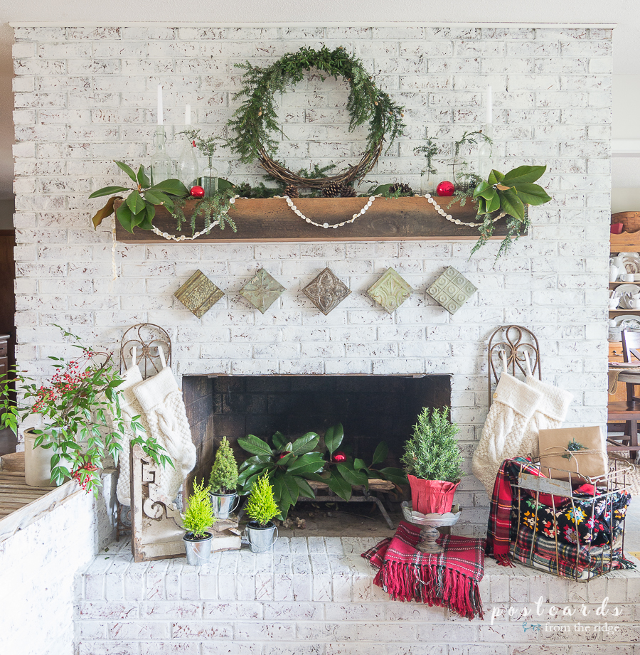 painted brick fireplace with Christmas decor