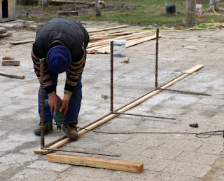 Drilling out screw holes to fix it to the wooden top Drilling out screw holes to fix it to the wooden top