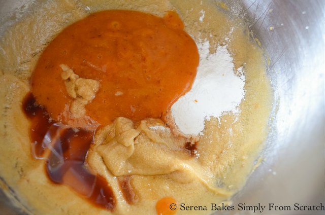 Peach Upside Down Cake recipe mix in baking powder, peach puree, and vanilla from Serena Bakes Simply From Scratch.