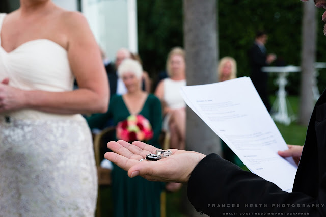 Wedding rings during ceremony at Villa Eva
