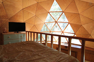 Upstairs loft at Mushroom Dome Cabin has a double bed