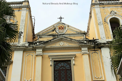 Exterior of St. Lawrence Church, forms Historic Centre of Macao featuring two symmetrical bell towers, tree and the entrance