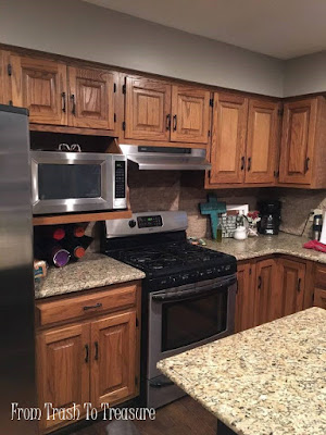Don't be afraid of painting your kitchen cabinets. Look at how paint can transform your entire kitchen! By From Trash To Treasure - featured on Furniture Flippin' www.FurnitureFlippin.com