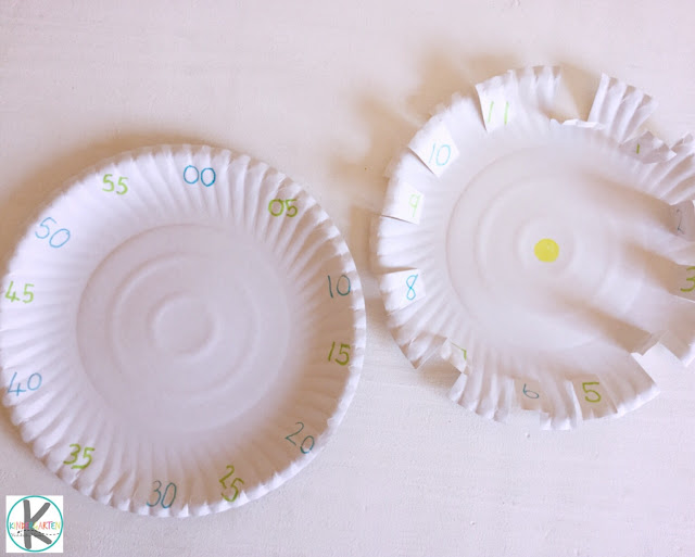 mark time on the paper plate clock by counting by 5s. Then cut slits around the times