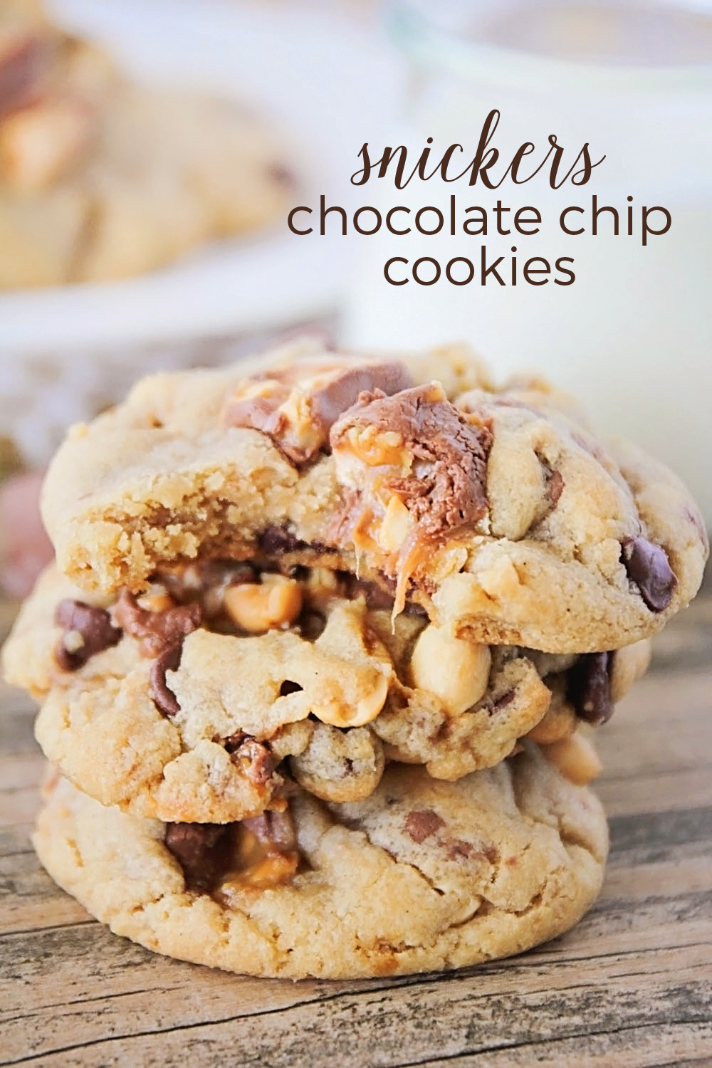 These Snickers chocolate chip cookies are to die for! Loaded with Snickers chunks, chocolate chips, and crunchy peanuts, they're just like your favorite candy bar in cookie form!