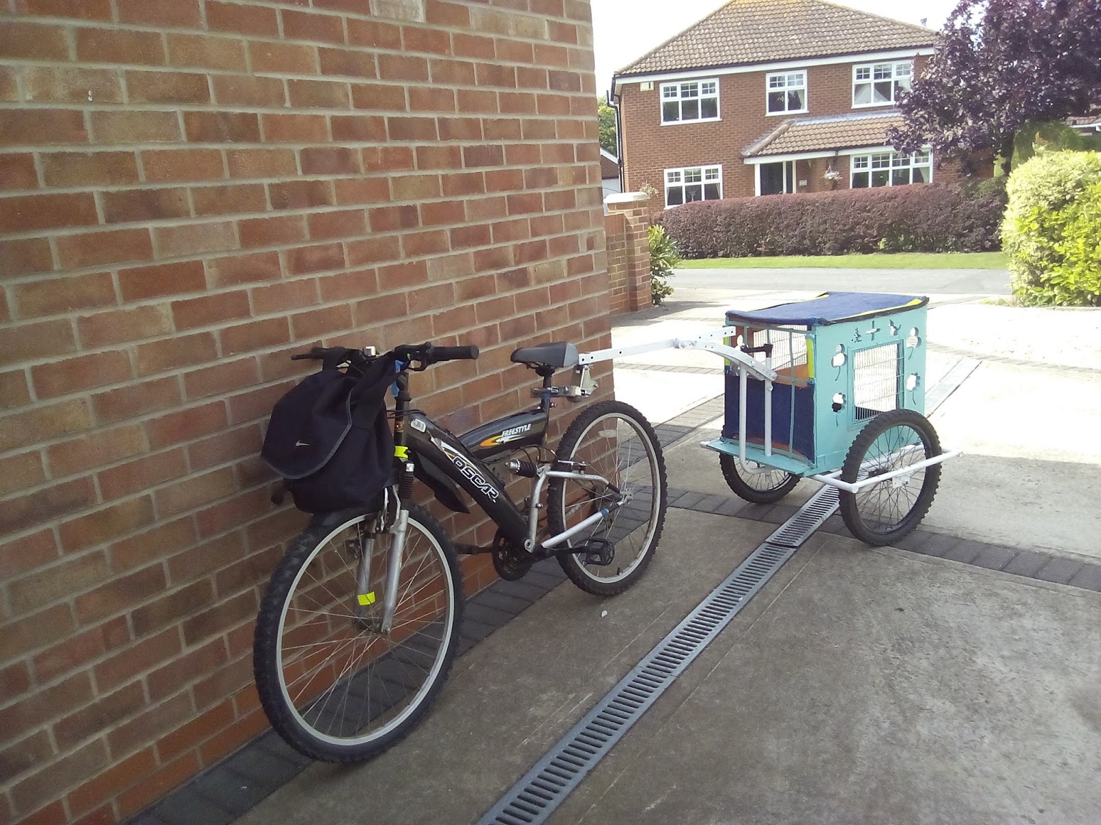Bicycle trailer connected to bicycle.