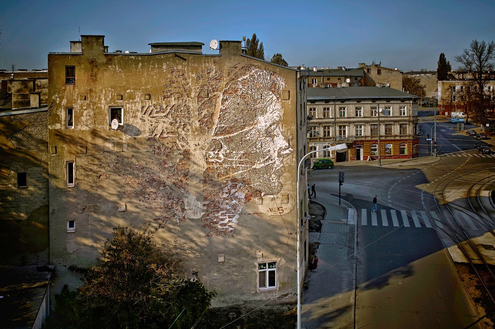 Portuguese street artist Vhils is part of this year's lineup of Urban Forms which is currently taking place on the streets of Lodz in Poland.