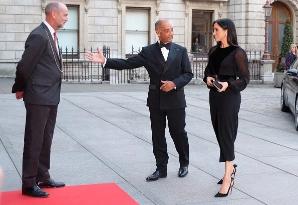 Meghan Markle wore Givenchy velvet Appliquéd midi dress, Birks snowflake snowstorm diamond earrings, Aquazzura Deneuve pumps, carries Givenchy clutch