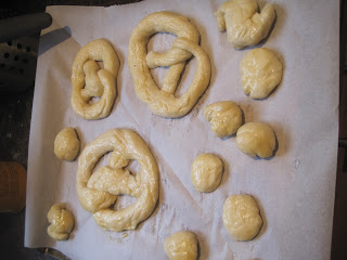 Unbaked pretzels on baking sheet