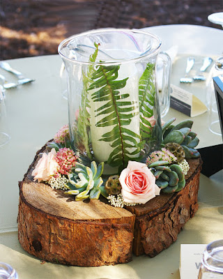 K'Mich Weddings - wedding planning - floral decor and tips - birch wood with votive surrounded by flowers for a centerpiece