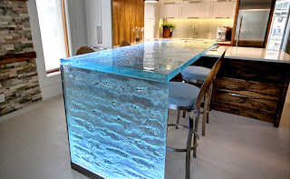 Blue Glass counter-tops and backsplash back-lit with custom LED light panels Blue Glass counter-tops and backsplash back-lit with custom LED light panels