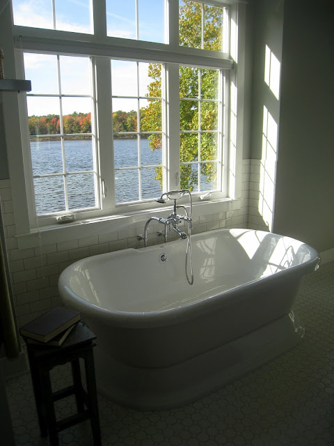 A large tub next to a window