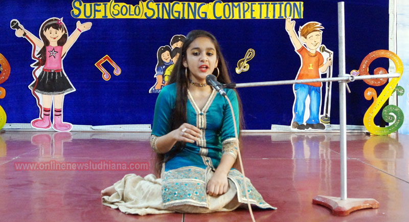 A student singing during Inter House Sufi Singing Competition at Green Land Convent School A student singing during Inter House Sufi Singing Competition at Green Land Convent School