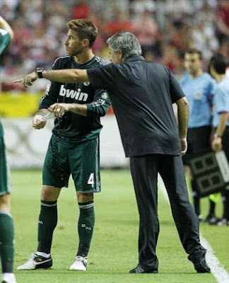 Mourinho talks to Ramos during the match against Sevilla