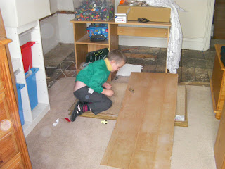bedroom undergoing refurbishment missing floorboards and plaster
